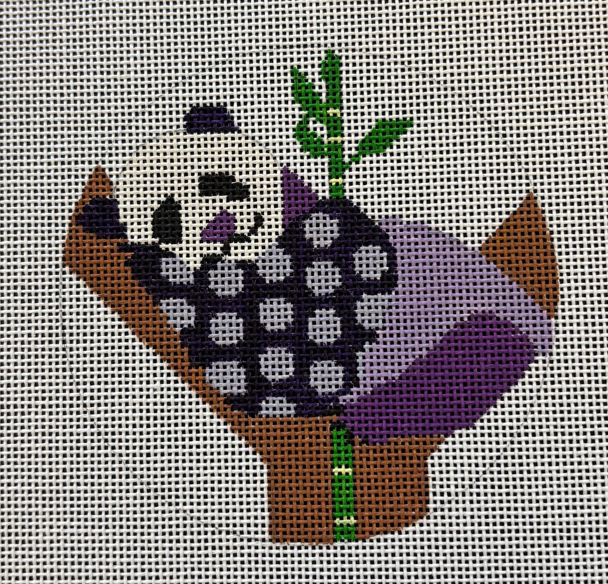 Melissa Prince round needlepoint canvas of a geometric purple panda in a tree with bamboo