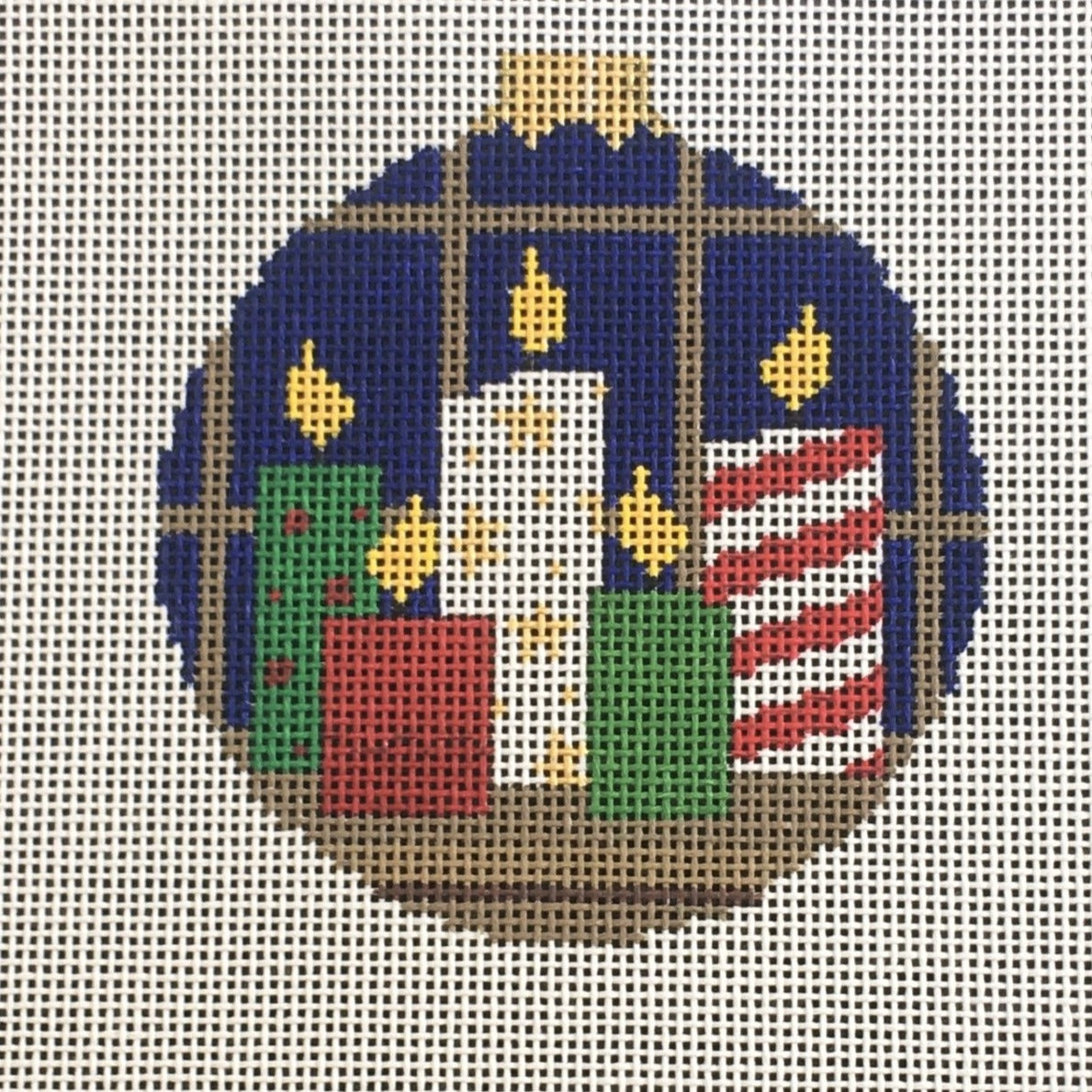 Susan Roberts needlepoint canvas Christmas ornament of festive candles in red white and green